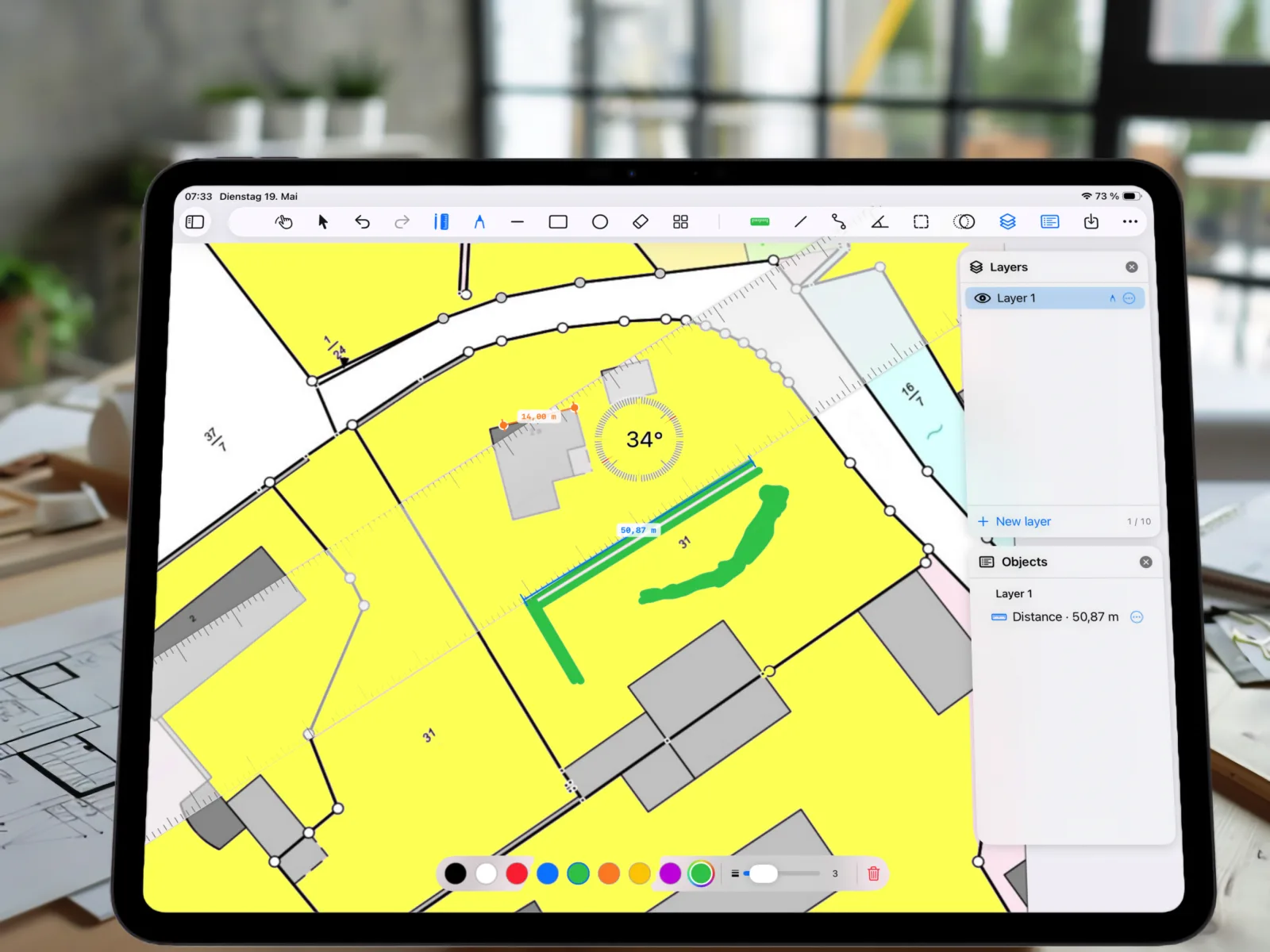 PlanMeasure on iPad: cadastral map with yellow-highlighted plot, 50.87 m distance measurement, 14.00 m segment, 34° angle, green pencil annotation and Layers/Objects panel